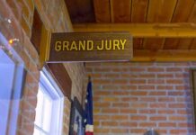 Deadly Roller Coaster Case Takes New Turn Grand jury sign in a brick-walled hallway