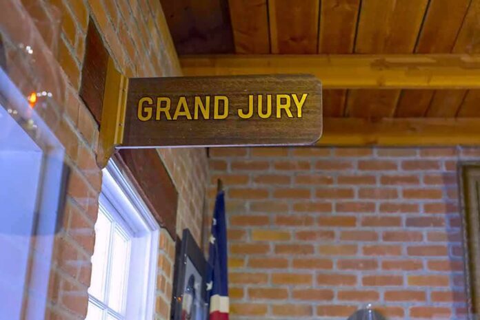 shutterstock_1162940617 Grand jury sign in a brick-walled hallway