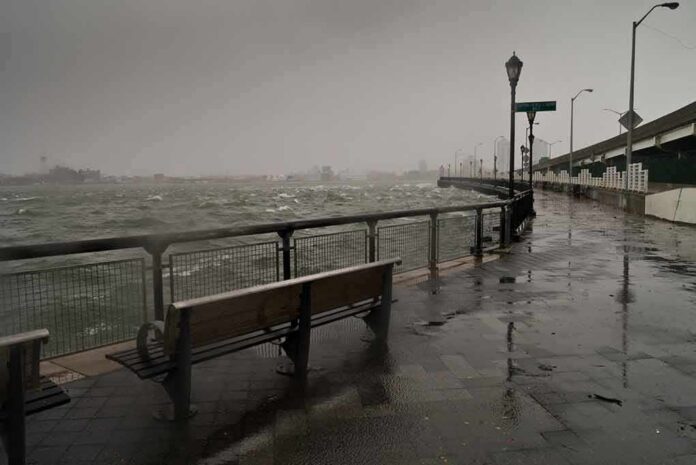 shutterstock_117079918 stormy waterfront promenade with benches and choppy water