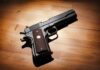 9/11 Confession Thrown Out Black handgun on wooden surface