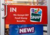 Discount Grocery Plan Triggers New Debate store door sign indicating EBT SNAP acceptance