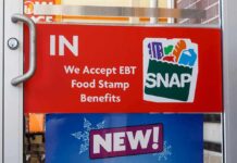 Discount Grocery Plan Triggers New Debate store door sign indicating EBT SNAP acceptance