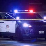 Bass Orders Review After Deadly LAPD Encounters Police SUV with flashing lights at night behind yellow tape