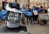 Democrats Warned: Voters May Punish Them Protesters holding signs at a voting rights rally