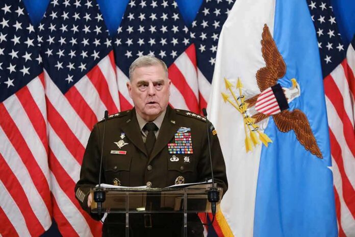 shutterstock_2262056547 Military officer speaks at podium with U.S. flags behind