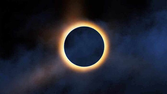 shutterstock_2321490351 Solar eclipse with bright corona around dark moon