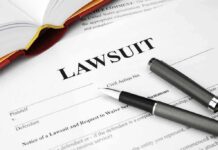 Judge Blocks Pentagon’s Anthropic Punishment Lawsuit document with pen and open book