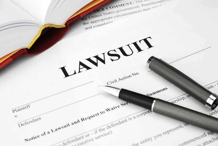 shutterstock_93505339 Lawsuit document with pen and open book