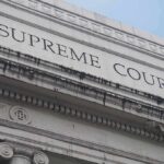 Supreme Court Halts Postal Ballot Changes Supreme Court building facade with classical columns