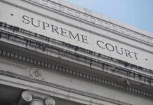 Supreme Court Halts Postal Ballot Changes Supreme Court building facade with classical columns