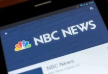 Hypocrisy Flare-Up: Campaign Signs Spark Backlash NBC News app screen on a smartphone