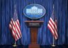 Trump Weighs Renewed Strikes on Iran White House press podium with microphones and two American flags