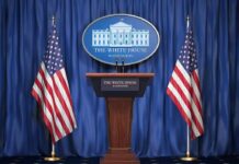 Trump Weighs Renewed Strikes on Iran White House press podium with microphones and two American flags