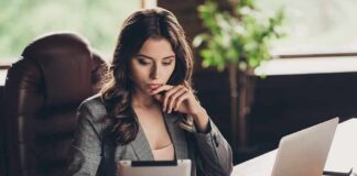 Woman in office using tablet at desk