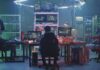 New AI Model Rolls Out With Cybersecurity Features People working at computers in a dim server room