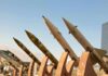 Iran Claims Missile Strikes on U.S. Targets in Jordan Row of surface-to-surface missiles mounted on display stands outdoors