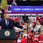 Convention Turns Into a Rally-Style Event Crowd at a political rally with a speaker at a podium; Stephen Paea, Curtis Lofton, Walter Jones, John Sullivan, and Colin David Jones present
