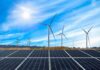 Clean Energy Projects Face $700B Setback Solar panels with wind turbines in a sunny landscape