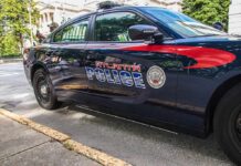 Death Investigation Begins After Man Found in Vent Atlanta police car parked on city street