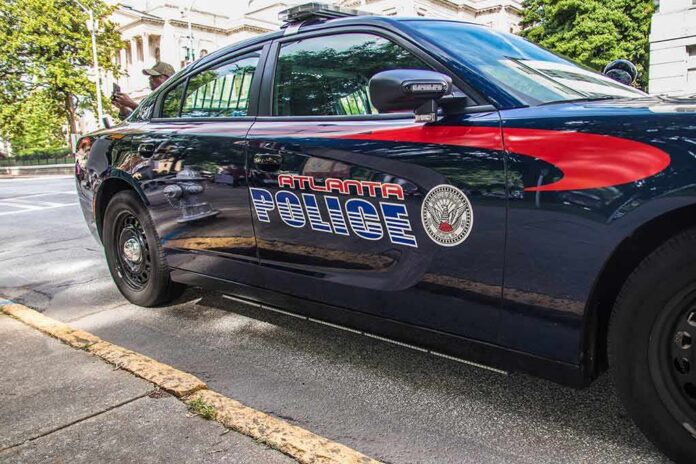 shutterstock_1753633301-1 Atlanta police car parked on city street