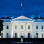 White House Lawn Transformed Into UFC Fight Arena White House illuminated at dusk with flagpole and columns