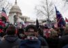 Democrats Push Toward House Control crowd with flags gathered outside the U.S. Capitol building