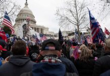 Democrats Push Toward House Control crowd with flags gathered outside the U.S. Capitol building
