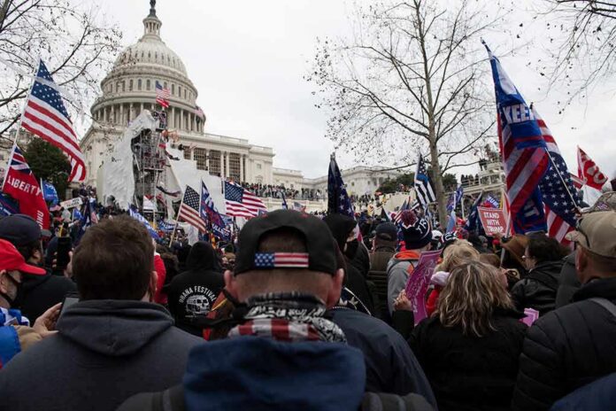 shutterstock_1890489586 crowd with flags gathered outside the U.S. Capitol building
