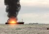 U.S. Strikes Three Iranian Tankers Amid Rising Tensions Cargo ship on fire with thick black smoke at sea