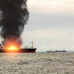 U.S. Strikes Three Iranian Tankers Amid Rising Tensions Cargo ship on fire with thick black smoke at sea