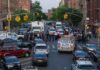 Brooklyn Carjacking Spree Ends in Arrests Police vehicles and officers block a city street during an active scene