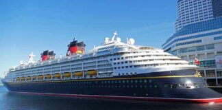 Cruise ship docked at a modern harbor terminal