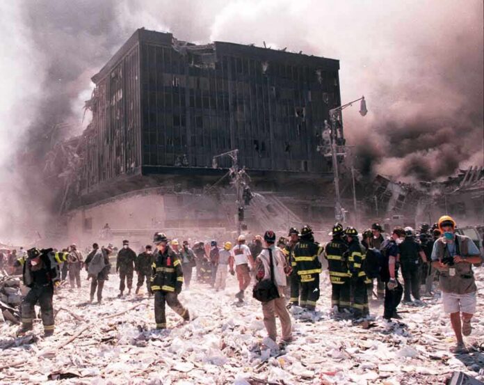 shutterstock_20814040 First responders amid debris near a heavily damaged building