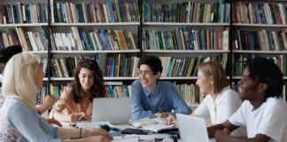 Students collaborating at a table in a library