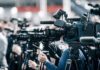 Far-Right Breakthrough Looms in Germany Broadcast cameras on tripods at a press event