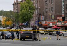 Body-Cam Shows Shooting Aftermath Police investigate a taped-off urban street crime scene