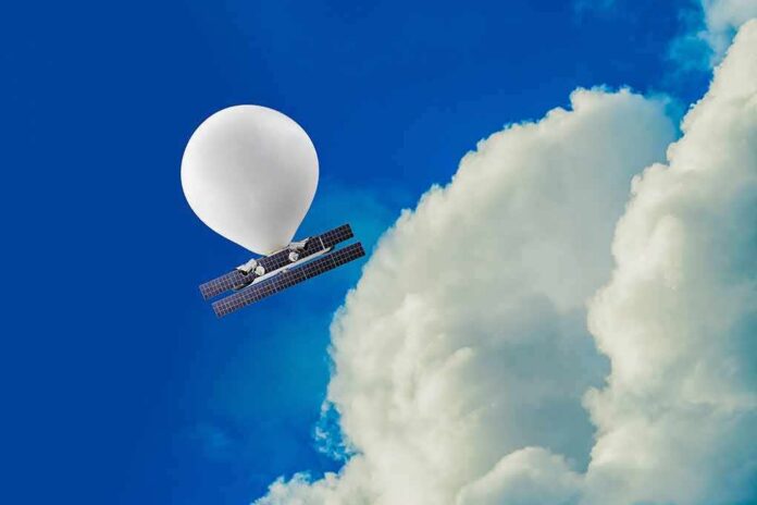 Weather balloon carrying solar-powered equipment near a large cloud