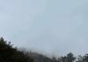 Hollywood Sign Stunt Ends in Arrest Hollywood sign partially hidden by fog on a hillside