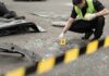 New Mother Killed in Random Stabbing Forensic investigator marking evidence at crash scene