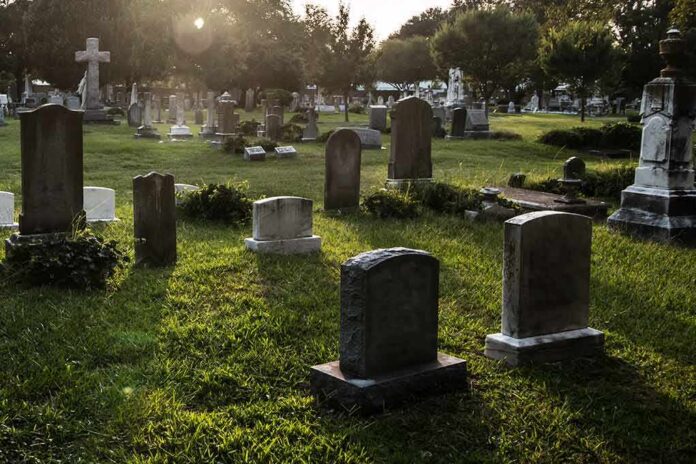 shutterstock_313803443 Gravestones in a sunlit cemetery