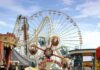 North Korea Builds a Leisure Network Colorful amusement park scene featuring a ferris wheel and carousel