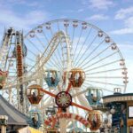 North Korea Builds a Leisure Network Colorful amusement park scene featuring a ferris wheel and carousel