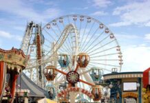 North Korea Builds a Leisure Network Colorful amusement park scene featuring a ferris wheel and carousel