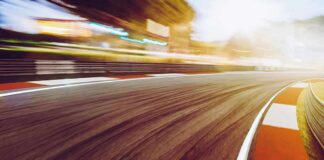 race track curve at sunset with motion blur