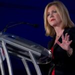 Woman speaking at a podium