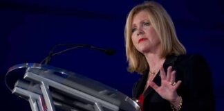 Woman speaking at a podium