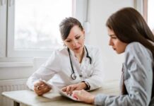 Finnish Study Finds Higher Psychiatric Care Doctor consulting a patient at a desk