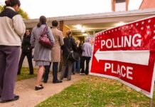 Voters standing in line outside a polling place