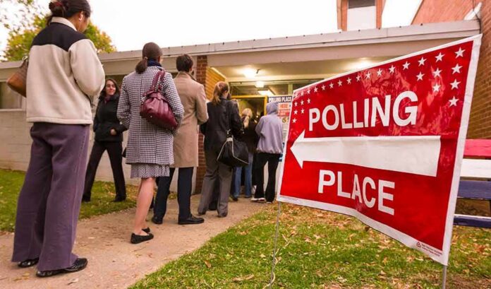 Voters standing in line outside a polling place