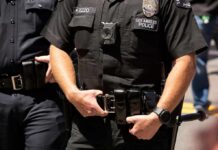 LAPD Chief Firing Plan Sparks Olympic Safety Concerns Police officers in black uniforms with duty belts